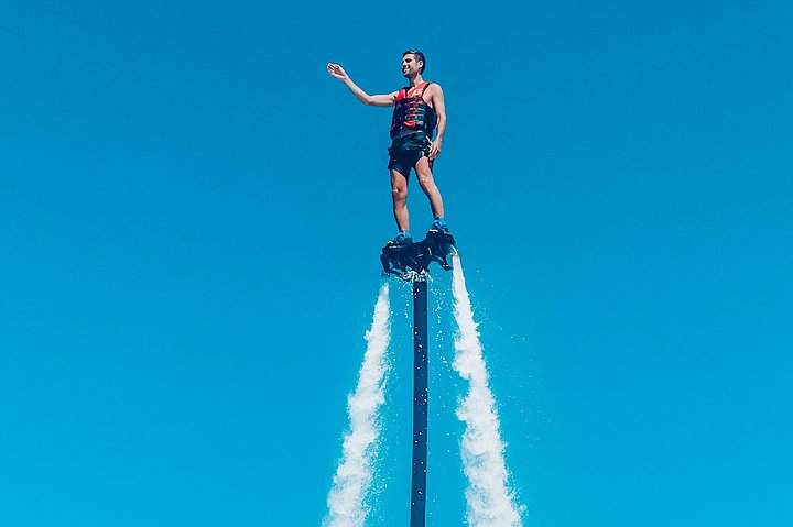 Experience the excitement of soaring high above Dubai water mastering the art of flyboarding with expert guidance and creating unforgettable memories in this stunning setting.